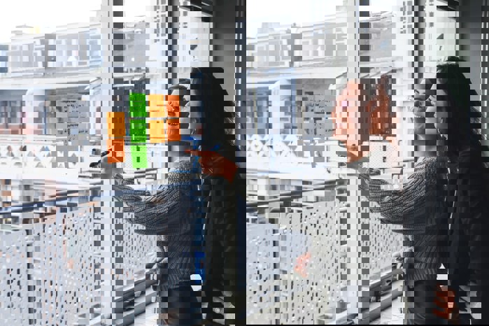 two female employees discussing and brainstorming with sticky notes