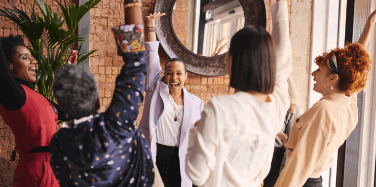 group of 5 diverse work colleagues celebrating