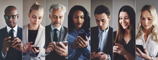 Seven workers who are shown to be on mobile devices in separate locations