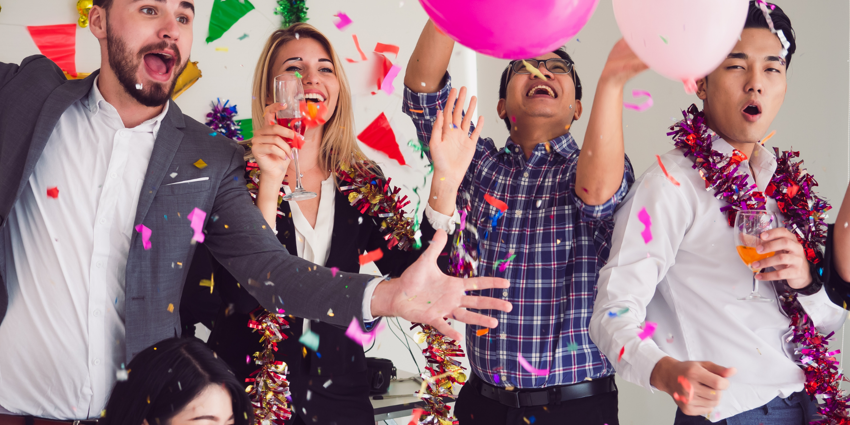 satisfied employees having fun at an office party