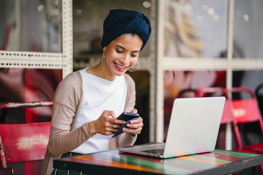 Woman engaging with colleagues through company intranet